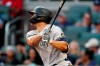 New York Yankees' Giancarlo Stanton follows though on a solo home run in the second during a baseball game against the Atlanta Braves, Monday, Aug. 23, 2021, in Atlanta. (AP Photo/John Bazemore)