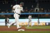 Pittsburgh Pirates' Yoshi Tsutsugo (32) rounds the bases after hitting a solo home run in the seventh inning of a baseball game against the Arizona Diamondbacks, Monday, Aug. 23, 2021, in Pittsburgh. (AP Photo/Keith Srakocic)