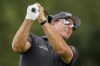 Phil Mickelson watches his shot off the 16th tee in the first round of play at the Northern Trust golf tournament, Thursday, Aug. 19, 2021, at Liberty National Golf Course in Jersey City, N.J. (AP Photo/John Minchillo)