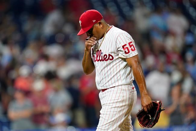 Philadelphia Phillies pitcher Ranger Suarez walks to the dugout after being pulled during the seventh inning of an interleague baseball game against the Tampa Bay Rays, Tuesday, Aug. 24, 2021, in Philadelphia. (AP Photo/Matt Slocum)
