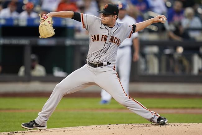 San Francisco Giants' Sammy Long winds up during the first inning of the team's baseball game against the New York Mets on Tuesday, Aug. 24, 2021, in New York. (AP Photo/Frank Franklin II)