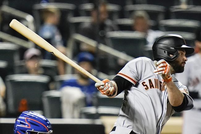 San Francisco Giants' Brandon Belt watches his RBI single during the eighth inning of a baseball game against the New York Mets on Tuesday, Aug. 24, 2021, in New York. (AP Photo/Frank Franklin II)