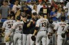 The San Francisco Giants celebrate after a baseball game against the New York Mets Tuesday, Aug. 24, 2021, in New York. The Giants won 8-0. (AP Photo/Frank Franklin II)