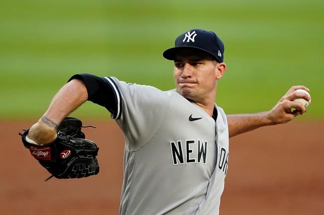 New York Yankees starting pitcher Andrew Heaney (38) works against the Atlanta Braves in the first inning of a baseball game Tuesday, Aug. 24, 2021, in Atlanta. (AP Photo/John Bazemore)