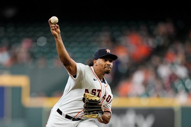 Houston Astros starting pitcher Luis Garcia throws against the Kansas City Royals during the first inning of a baseball game Tuesday, Aug. 24, 2021, in Houston. (AP Photo/David J. Phillip)