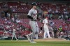 Detroit Tigers' Casey Mize heads to first on a bases-loaded walk by St. Louis Cardinals starting pitcher Jack Flaherty, right, during the second inning of a baseball game Tuesday, Aug. 24, 2021, in St. Louis. (AP Photo/Jeff Roberson)