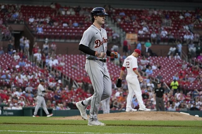 Detroit Tigers' Casey Mize heads to first on a bases-loaded walk by St. Louis Cardinals starting pitcher Jack Flaherty, right, during the second inning of a baseball game Tuesday, Aug. 24, 2021, in St. Louis. (AP Photo/Jeff Roberson)