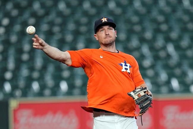 Houston Astros third baseman Alex Bregman fields ground balls before a baseball game against the Seattle Mariners Saturday, Aug. 21, 2021, in Houston. Bregman has been on the injured list. (AP Photo/David J. Phillip)