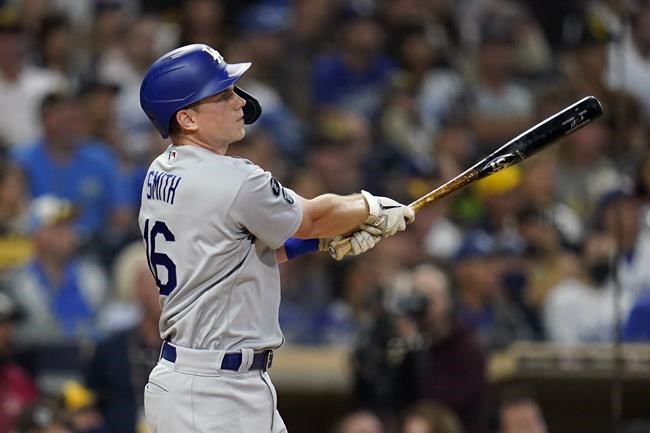 Los Angeles Dodgers' Will Smith watches his home run hit during the second inning of a baseball game against the San Diego Padres, Tuesday, Aug. 24, 2021, in San Diego. (AP Photo/Gregory Bull)