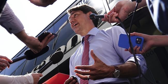 Liberal Leader Justin Trudeau talks with reporters in from Hamilton, Ont., on Tuesday, Aug. 24, 2021. THE CANADIAN PRESS/Sean Kilpatrick