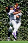Colorado Rockies left fielder Connor Joe, left, and center fielder Sam Hilliard collide going after a fly ball hit by Chicago Cubs' Frank Schwindel during the first inning in the first baseball game of a doubleheader in Chicago, Wednesday, Aug. 25, 2021. (AP Photo/Nam Y. Huh)