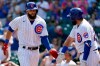 Chicago Cubs' David Bote, left, celebrates with Austin Romine after hitting a solo home run in the second inning in the first baseball game of a doubleheader against the Colorado Rockies in Chicago, Wednesday, Aug. 25, 2021. (AP Photo/Nam Y. Huh)