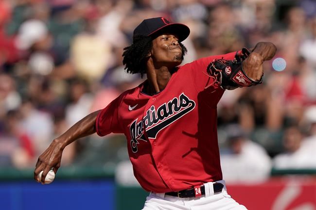 Cleveland Indians starting pitcher Triston McKenzie delivers in the first inning of a baseball game against the Los Angeles Angels, Saturday, Aug. 21, 2021, in Cleveland. (AP Photo/Tony Dejak)