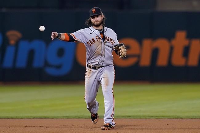 San Francisco Giants shortstop Brandon Crawford throws out Oakland Athletics' Matt Chapman during the fourth inning of a baseball game in Oakland, Calif., Friday, Aug. 20, 2021. (AP Photo/Jeff Chiu)