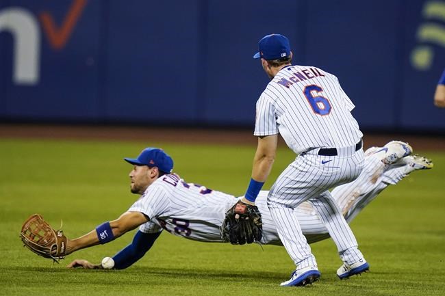 New York Mets' Michael Conforto, left, loses control of a ball hit by San Francisco Giants' Alex Dickerson for a single as Jeff McNeil, right, watches during the seventh inning of a baseball game Wednesday, Aug. 25, 2021, in New York. (AP Photo/Frank Franklin II)