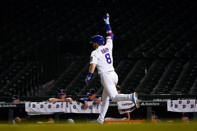 Chicago Cubs' Ian Happ celebrates his three-run home run off Colorado Rockies relief pitcher Daniel Bard, to tie the game, in the seventh inning of the second game of a baseball doubleheader Wednesday, Aug. 25, 2021, in Chicago. (AP Photo/Charles Rex Arbogast)