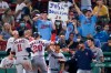 Minnesota Twins' Josh Donaldson (20) is congratulated after his tie-breaking, two-run home run during the 10th inning of a baseball game against the Boston Red Sox at Fenway Park, Wednesday, Aug. 25, 2021, in Boston. (AP Photo/Charles Krupa)