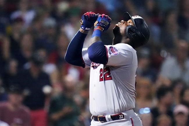 Minnesota Twins' Miguel Sano celebrates after his solo home run off Boston Red Sox starting pitcher Nick Pivetta during the third inning of a baseball game at Fenway Park, Wednesday, Aug. 25, 2021, in Boston. (AP Photo/Charles Krupa)