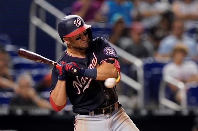 Washington Nationals' Carter Kieboom is hit by a pitch during the fifth inning of the team's baseball game against the Miami Marlins, Wednesday, Aug. 25, 2021, in Miami. (AP Photo/Wilfredo Lee)