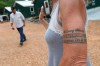Gretchen Catherwood works at Darkhorse Lodge, with her husband Kirk, left, on Wednesday, Aug. 18, 2021. On her arm is a tattoo replica of the bracelet she had made in memory of her son, Alec, who died in Afghanistan. (AP Photo/Karen Pulfer Focht)