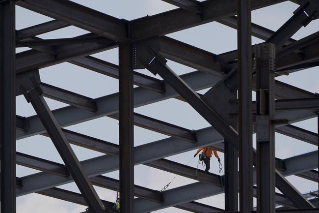 Construction personnel work on Carolina Panthers' state-of-the-art team headquarters and practice facility Tuesday, Aug. 24, 2021, in Rock Hill, S.C.