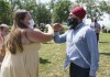 NDP leader Jagmeet Singh greets a supporter in a park in Windsor, Ontario on Wednesday, Aug. 25, 2021. THE CANADIAN PRESS/Paul Chiasson