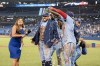 Toronto Blue Jays' George Springer (4) is doused in water by his teammates during an interview after American League baseball against the Boston Red Sox in Toronto, Sunday, Aug. 8, 2021. Springer appeared one step closer to returning to the Toronto lineup after completing base-running drills Thursday before the Blue Jays' afternoon game against the Chicago White Sox. THE CANADIAN PRESS/Christopher Katsarov