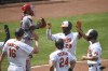 Baltimore Orioles' Pedro Severino (28) is greeted by teammates after hitting grand slam off Los Angeles Angels relief pitcher Jake Petricka during the fifth inning of a baseball game, Thursday, Aug. 26, 2021, in Baltimore. (AP Photo/Terrance Williams)