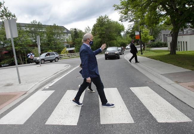 Conservative Leader Erin OToole crosses the street while campaigning Friday, August 27, 2021 in Corner Brook, Newfoundland. Canadians will vote in a federal election Sept. 20th.THE CANADIAN PRESS/Ryan Remiorz