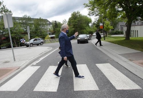 Conservative Leader Erin OToole crosses the street while campaigning Friday, August 27, 2021 in Corner Brook, Newfoundland. Canadians will vote in a federal election Sept. 20th.THE CANADIAN PRESS/Ryan Remiorz