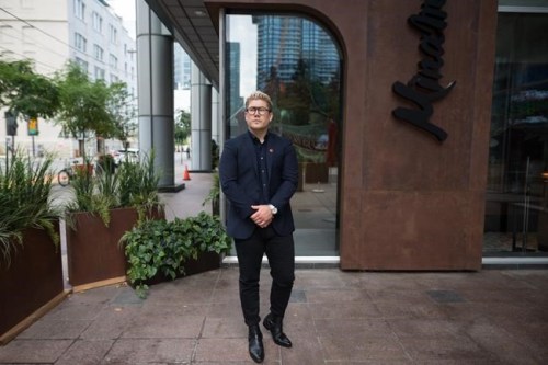Dean Harrison, Aburi Restaurants Canada's national director of marketing, poses for a photograph at the restaurant Minami, in Toronto, Monday, Aug. 23, 2021. THE CANADIAN PRESS/Tijana Martin