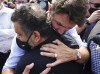 Liberal Leader Justin Trudeau hugs Merzhad Zarei as he makes a campaign whistle-stop in Richmond Hill, Ont., on Friday, Aug. 27, 2021. He lost his 18-year-old son Arad Zarei on Ukraine International Airlines Flight PS752 on Jan. 8, 2020. THE CANADIAN PRESS/Sean Kilpatrick