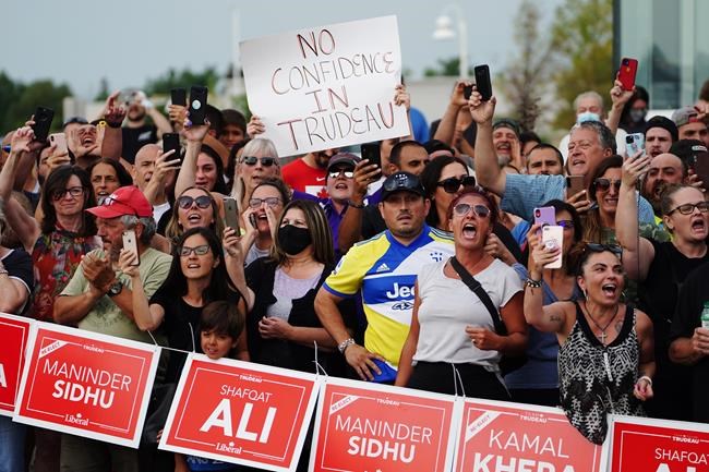 Protesters wait for Liberal Leader Justin Trudeau to arrive at a campaign event in Bolton, Ont. on Friday, August 27, 2021. THE CANADIAN PRESS/Sean Kilpatrick