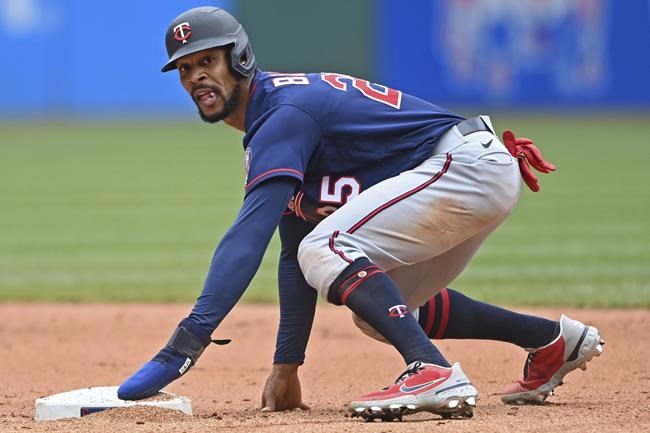 FILE - In this April 28, 2021, file photo, Minnesota Twins' Byron Buxton reacts after stealing second base during the sixth inning of the team's baseball game against the Cleveland Indians in Cleveland. Buxton has been reinstated from the injured list. He missed 55 games while his broken left pinky finger healed. The oft-sidelined star played in only three games after returning June 19 from a strained right hip that kept him out for 39 games. (AP Photo/David Dermer, File)