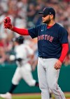 Boston Red Sox starting pitcher Eduardo Rodriguez waits for Cleveland Indians' Yu Chang to run the bases on a solo home run during the seventh inning of a baseball game Friday, Aug. 27, 2021, in Cleveland. (AP Photo/Tony Dejak)