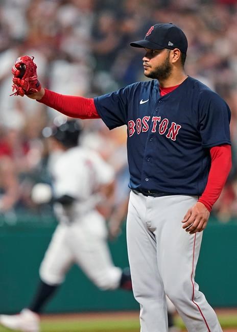 Boston Red Sox starting pitcher Eduardo Rodriguez waits for Cleveland Indians' Yu Chang to run the bases on a solo home run during the seventh inning of a baseball game Friday, Aug. 27, 2021, in Cleveland. (AP Photo/Tony Dejak)