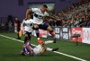 Pacific FCs' Kadin Chung kicks the ball away from Vancouver Whitecaps' Jakob Nerwinski during first-half Canadian Championship preliminary-round soccer action at Starlight Stadium in Langford, B.C., on Thursday, August 26, 2021. THE CANADIAN PRESS/Chad Hipolito