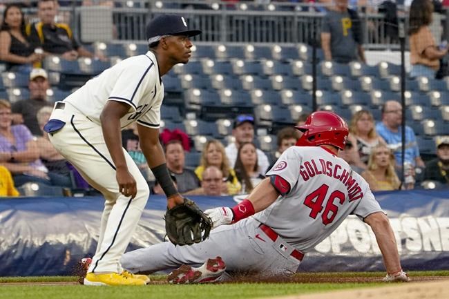 St. Louis Cardinals' Paul Goldschmidt slides into third with a triple as Pittsburgh Pirates third baseman Ke'Bryan Hayes awaits the throw during the first inning of a baseball game Friday, Aug. 27, 2021, in Pittsburgh. (AP Photo/Keith Srakocic)