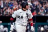 Chicago White Sox's Yasmani Grandal heads to first on a two-run double during the fifth inning of the team's baseball game against the Chicago Cubs in Chicago, Friday, Aug. 27, 2021. (AP Photo/Nam Y. Huh)