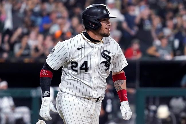Chicago White Sox's Yasmani Grandal heads to first on a two-run double during the fifth inning of the team's baseball game against the Chicago Cubs in Chicago, Friday, Aug. 27, 2021. (AP Photo/Nam Y. Huh)