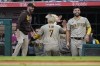 San Diego Padres' Ha-Seong Kim (7) celebrates after scoring off of a triple hit by Jurickson Profar during the second inning of a baseball game against the Los Angeles Angels Friday, Aug. 27, 2021, in Anaheim, Calif. (AP Photo/Ashley Landis)