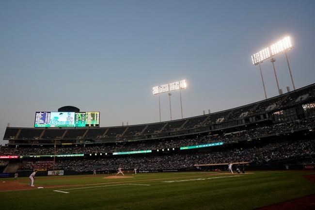 New York Yankees' Gerrit Cole, center bottom, pitches against the Oakland Athletics during the third inning of a baseball game in Oakland, Calif., Friday, Aug. 27, 2021. (AP Photo/Jeff Chiu)