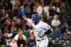 Kansas City Royals' Salvador Perez points skyward as he heads home on his grand slam against the Seattle Mariners in the fourth inning of a baseball game Friday, Aug. 27, 2021, in Seattle. (AP Photo/Elaine Thompson)