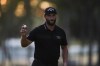 Jon Rahm, of Spain, reacts after sinking his putt on the 15th green during the second round of the BMW Championship golf tournament, Friday, Aug. 27, 2021, at Caves Valley Golf Club in Owings Mills, Md. (AP Photo/Julio Cortez)