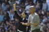 Arsenal's manager Mikel Arteta, left, and Manchester City's head coach Pep Guardiola gesture during the English Premier League soccer match between Manchester City and Arsenal at Etihad stadium in Manchester, England, Saturday, Aug. 28, 2021. (AP Photo/Rui Vieira)