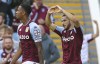 Aston Villa's Emiliano Buendia, right celebrates scoring his side's first goal of the game during the English Premier League soccer match between Aston Villa and Brentford, at Villa Park, in Birmingham, England, Saturday Aug. 28, 2021. (Barrington Coombs/PA via AP)