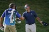 Sergio Garcia, right, of Spain, shakes hands with Hudson Swafford's caddie after completing his round during the third round of the BMW Championship golf tournament, Saturday, Aug. 28, 2021, at Caves Valley Golf Club in Owings Mills, Md. (AP Photo/Julio Cortez)