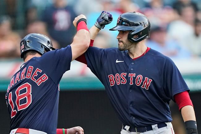 Boston Red Sox's J.D. Martinez, right, celebrates with Kyle Schwarber after hitting a three-run home run in the 10th inning of a baseball game against the Cleveland Indians, Saturday, Aug. 28, 2021, in Cleveland. (AP Photo/Tony Dejak)