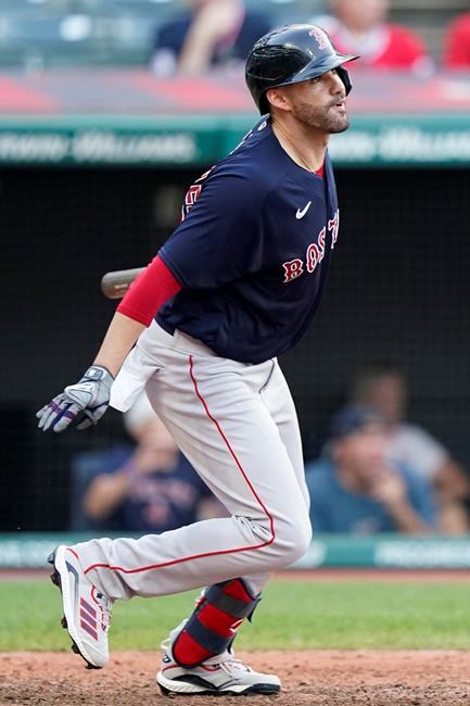 Boston Red Sox's J.D. Martinez watches his three-run home run in the 10th inning of a baseball game against the Cleveland Indians, Saturday, Aug. 28, 2021, in Cleveland. (AP Photo/Tony Dejak)