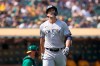 New York Yankees' Giancarlo Stanton walks to the dugout after striking out against the Oakland Athletics during the seventh inning of a baseball game in Oakland, Calif., Saturday, Aug. 28, 2021. (AP Photo/Jeff Chiu)